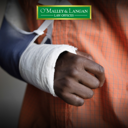 Injured Scranton worker with their bandaged arm in a sling