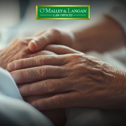 A close up of clasped hands, indicating giving comfort to someone with a long-term illness