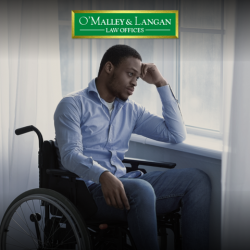 A Scranton, PA social security disability recipient in wheelchair looking out window