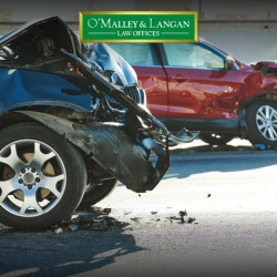 Two cars sit in the road damaged cars after a collision in Scranton, PA